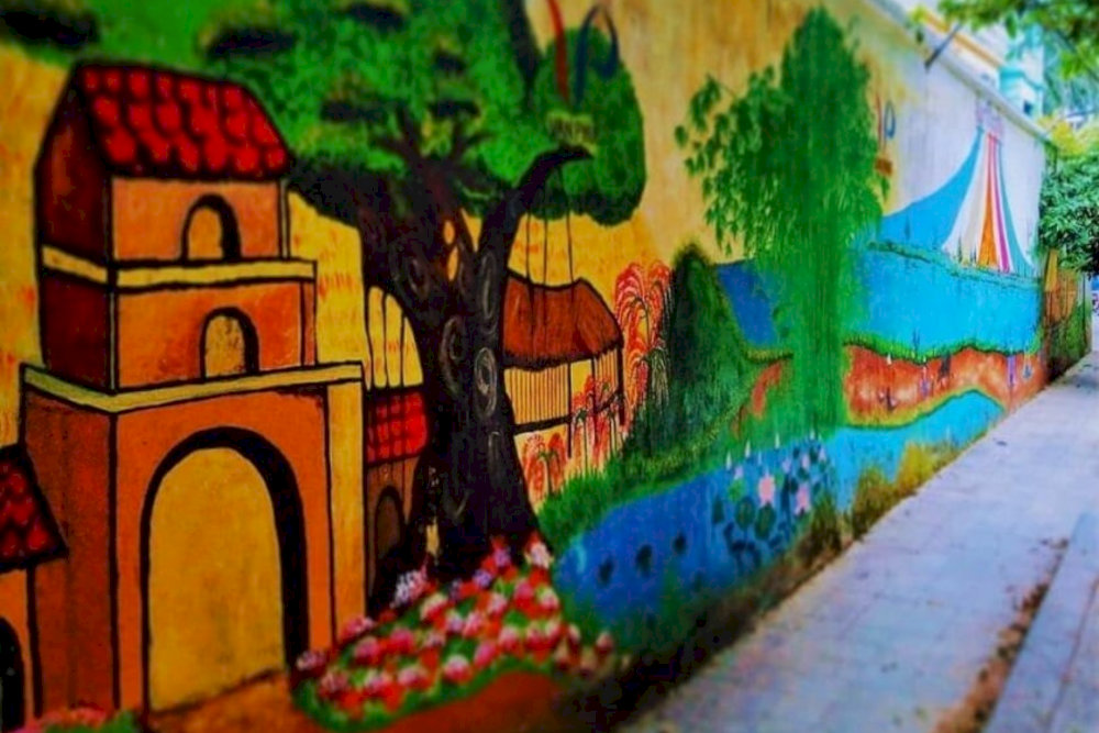 Located at the heart of the village, the mural serves as a perfect backdrop for memorable photos